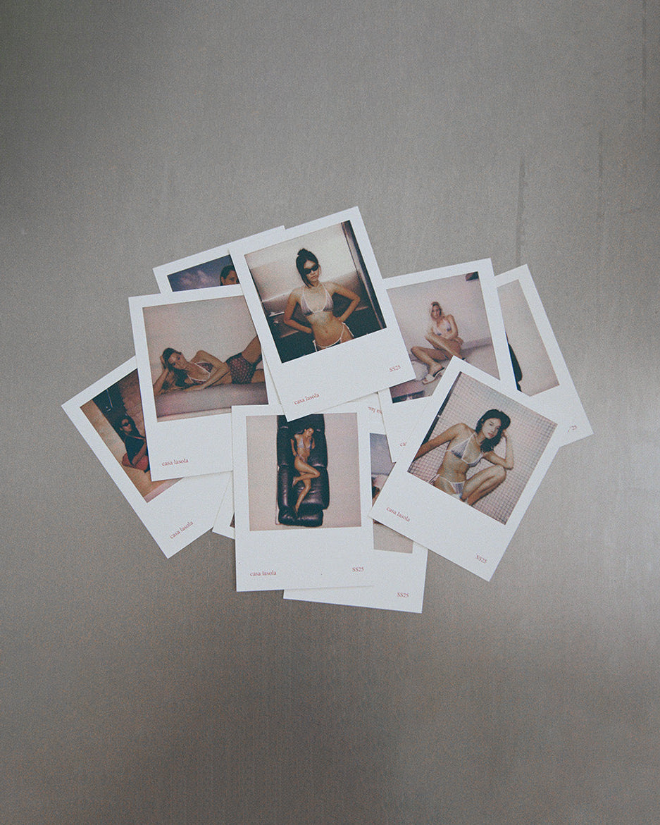 Collection of Polaroid photos on a gray surface